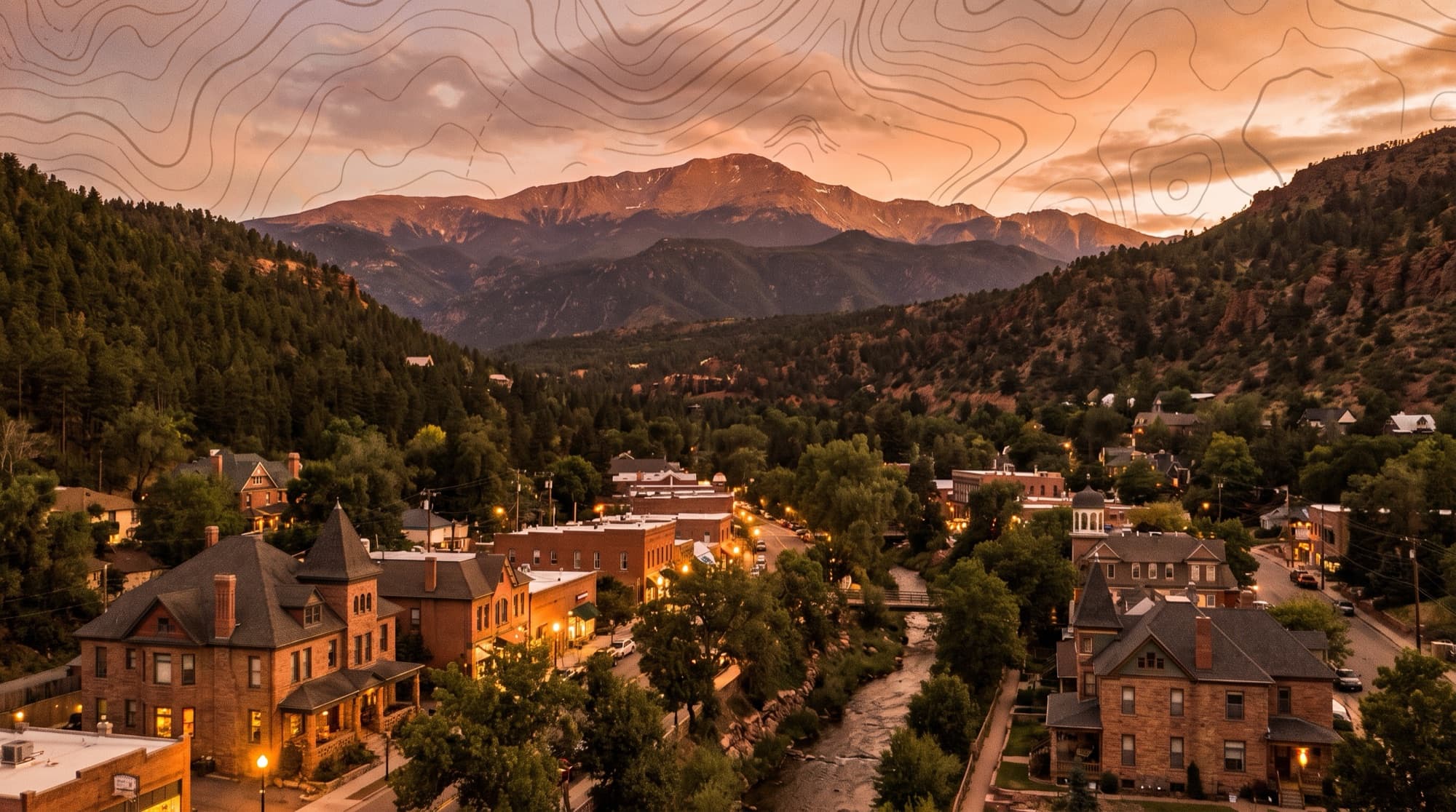The historic Victorian town of Manitou Springs nestled in its canyon at the foot of Pikes Peak at dusk